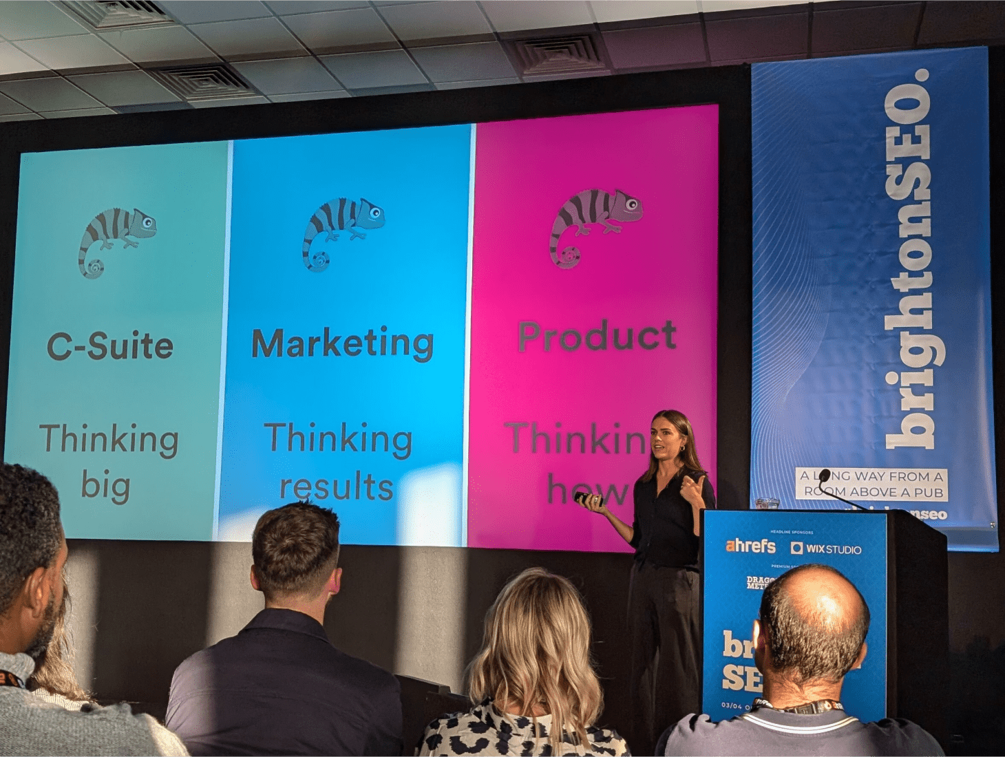 Image shows senior SEO consultant Ashleigh Noad presenting on stage at BrightonSEO.